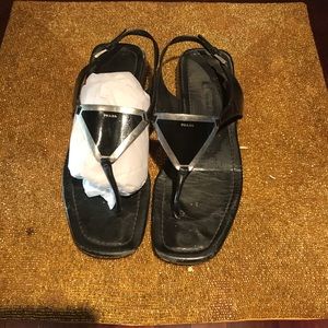 Black Prada sandals.